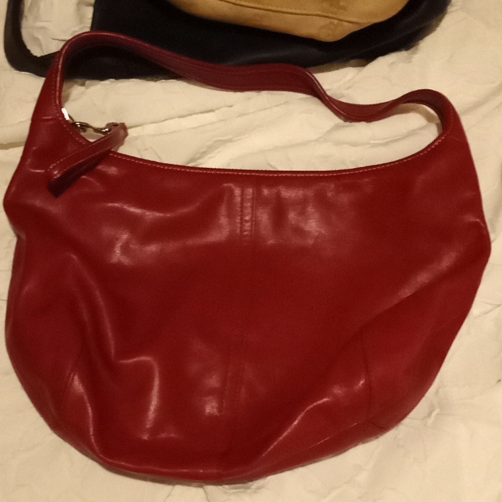 Leather coach bag more like a dark red